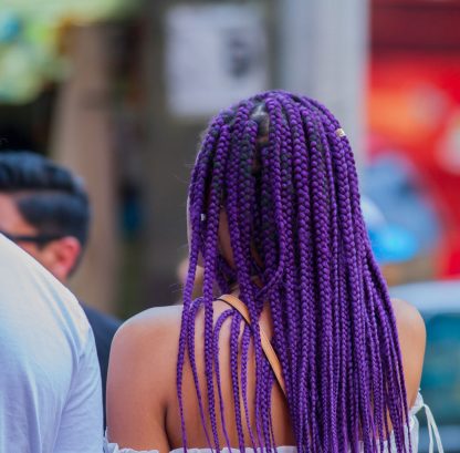 beautiful wife with ultra violet hairs photographed from behind