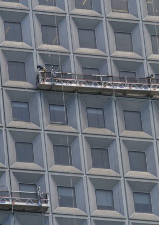 window cleaning at height, example of a real-world stock photo with geometric shapes